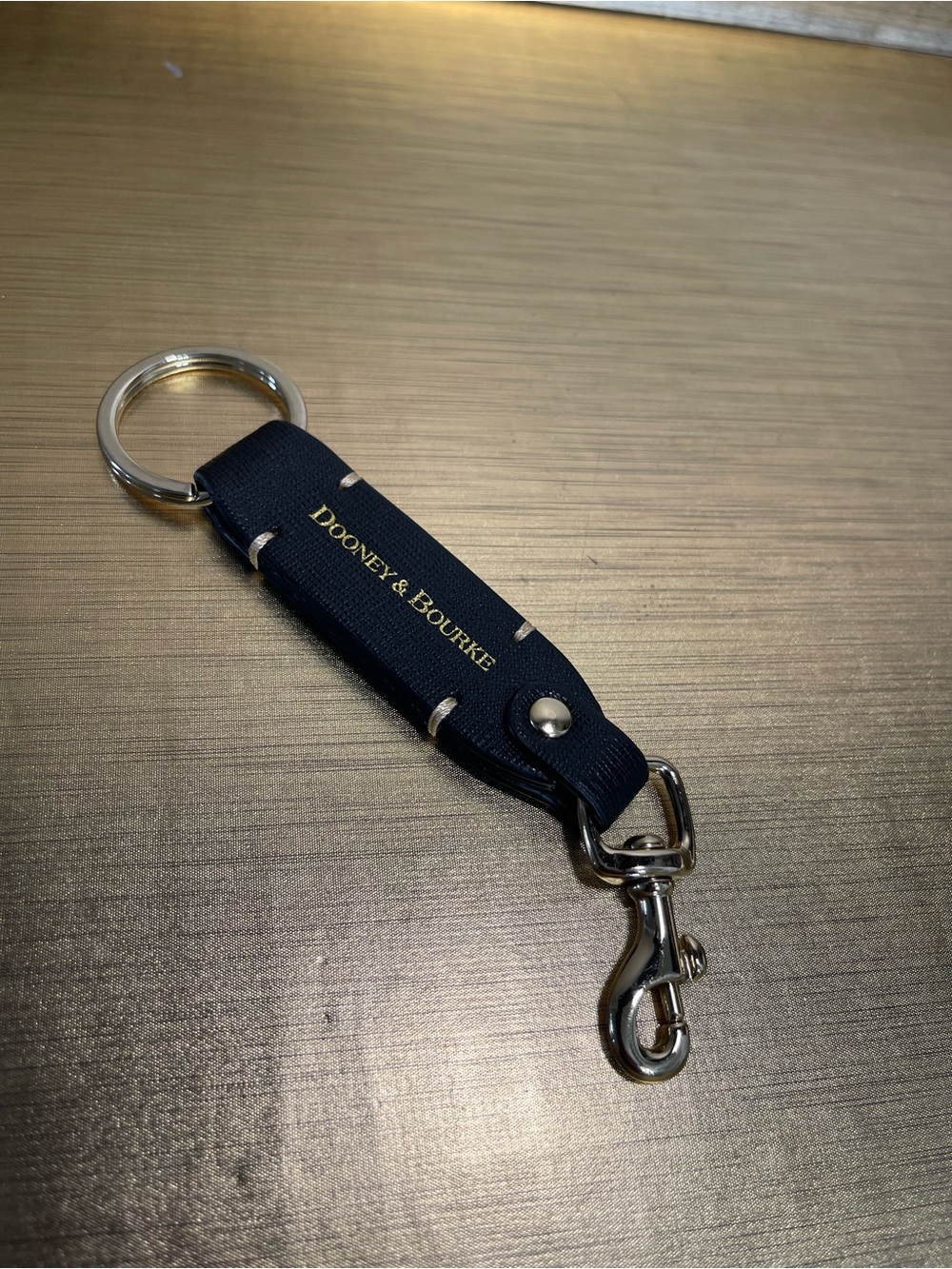 Dooney & Bourke Black Key Fob with Gold Logo and Silver Hardware